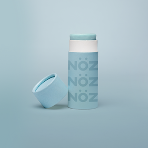 A package of Nöz classic sunscreen in the blue variety in front of a blue background